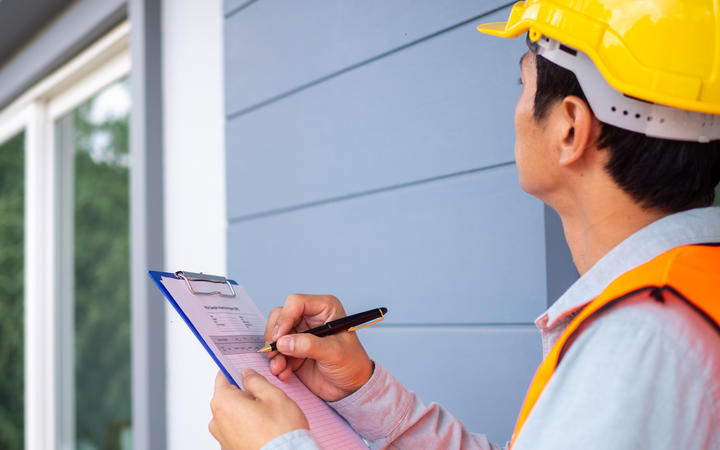 Sloppy builders and an increase in building consents are contributing to the lengthy delays some are facing when booking a building inspection.