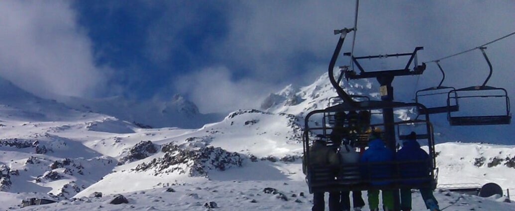 Skiers on a chairlift at Turoa ski field