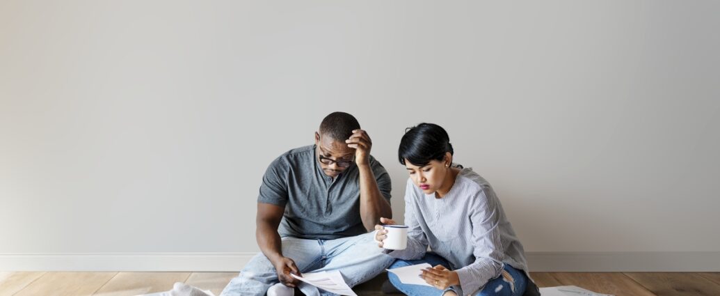 Stressed couple figuring out their finances