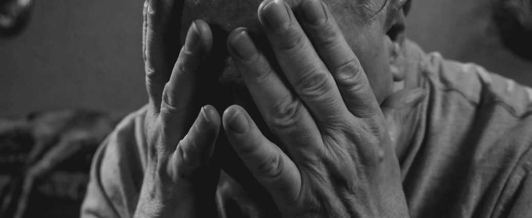 Photo by Kindel Media: https://www.pexels.com/photo/a-grayscale-photo-of-an-elderly-man-covering-his-face-8172278/