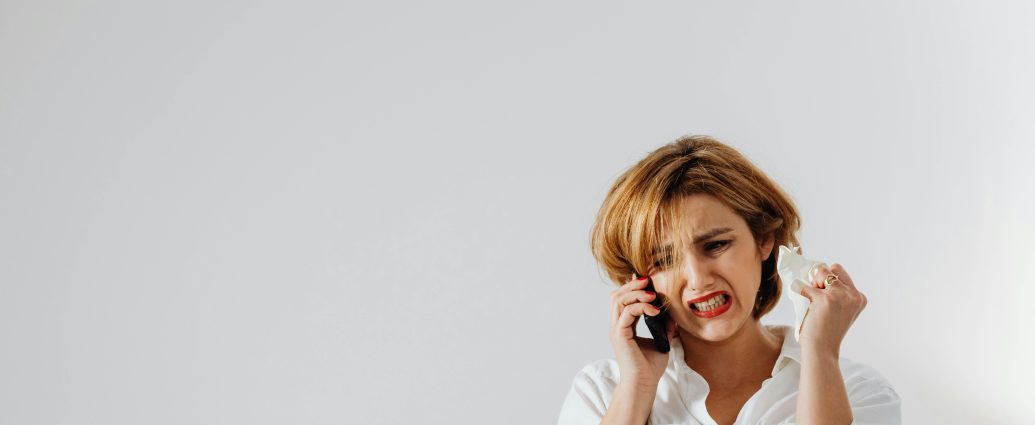 Photo by Photo By: Kaboompics.com: https://www.pexels.com/photo/a-woman-in-white-long-sleeve-shirt-looking-angry-while-having-a-phone-call-6028583/