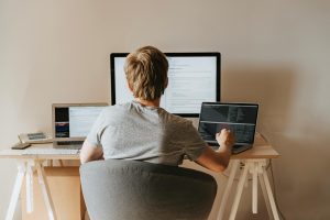 Photo by olia danilevich: https://www.pexels.com/photo/back-view-of-a-boy-sitting-on-grey-chair-while-using-his-laptop-computers-4974916/
