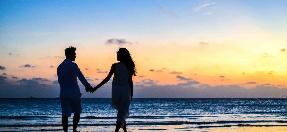 Photo by Asad Photo Maldives: https://www.pexels.com/photo/man-and-woman-holding-hands-walking-on-seashore-during-sunrise-1024960/