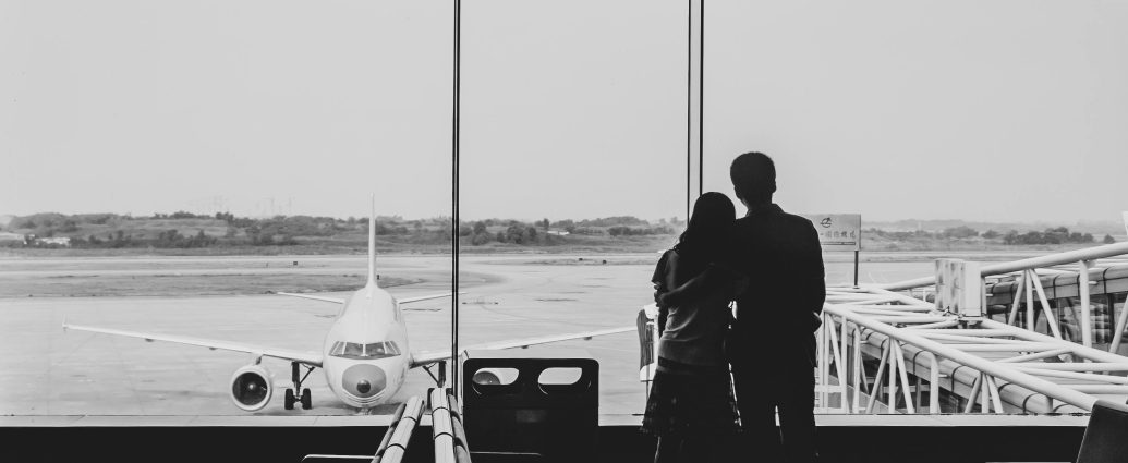 Photo by Cheng Shi Song: https://www.pexels.com/photo/back-view-of-couple-embracing-at-airport-21235995/