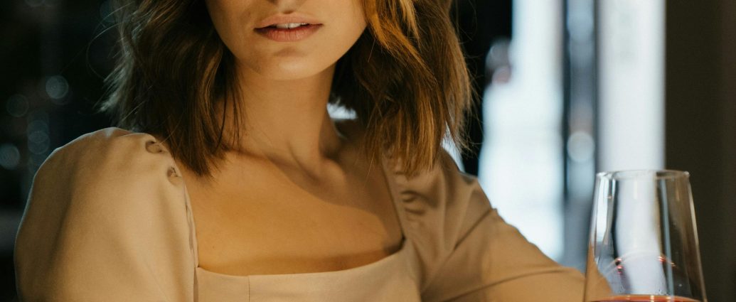 Photo by cottonbro studio: https://www.pexels.com/photo/woman-in-brown-long-sleeve-shirt-holding-wine-glass-4691215/