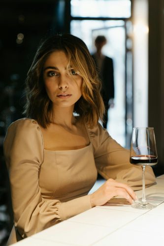 Photo by cottonbro studio: https://www.pexels.com/photo/woman-in-brown-long-sleeve-shirt-holding-wine-glass-4691215/