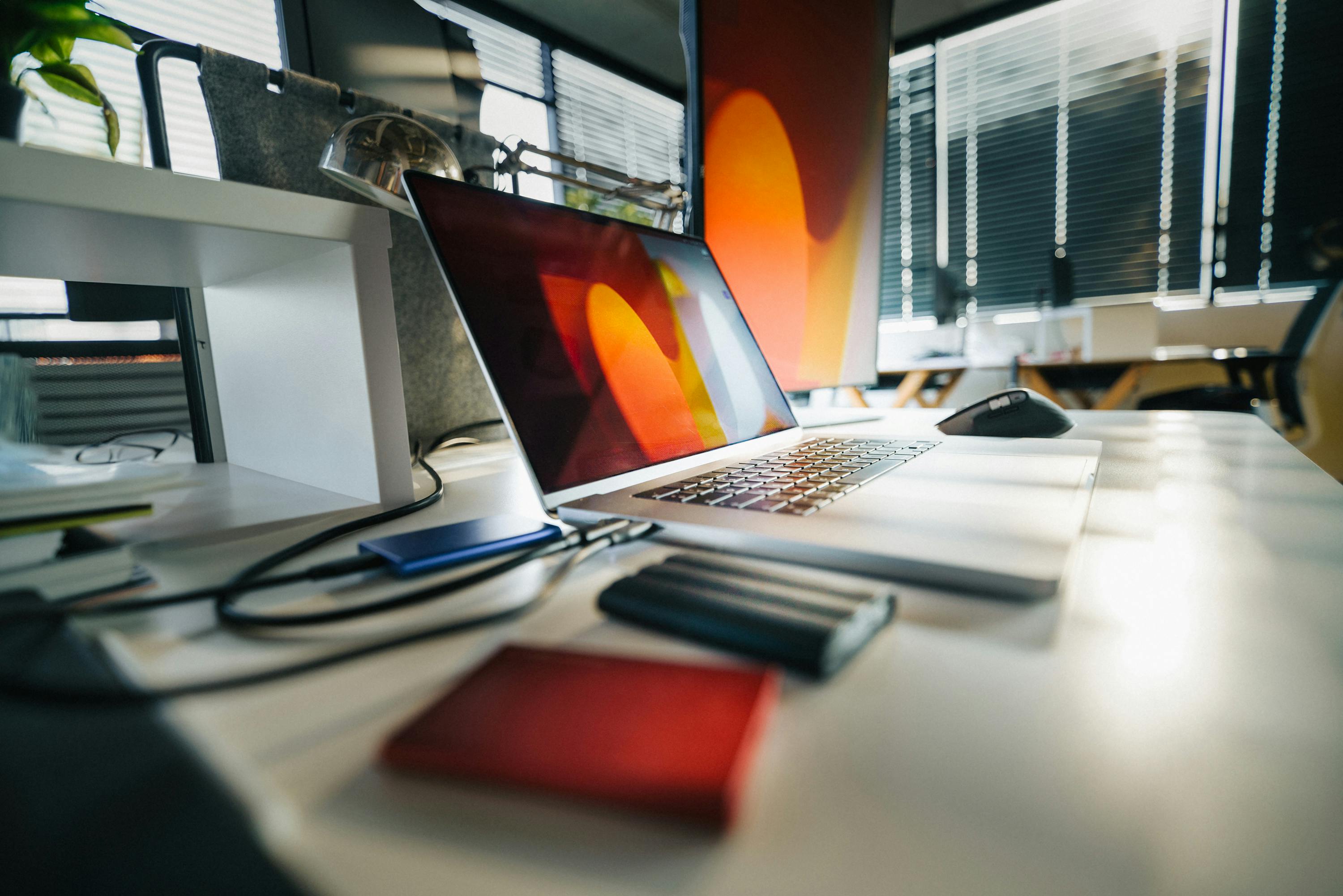 Photo by Jakub Zerdzicki: https://www.pexels.com/photo/modern-office-workspace-with-laptop-and-external-drives-29238152/