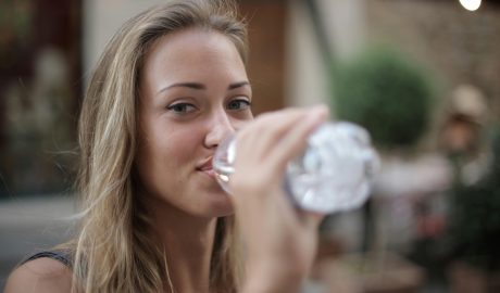 Photo by Andrea Piacquadio: https://www.pexels.com/photo/selective-focus-photo-of-smiling-woman-drinking-water-from-a-plastic-bottle-3763929/