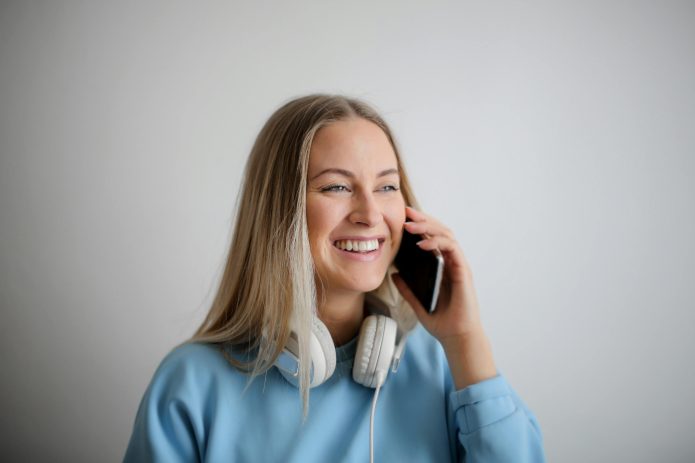 Photo by Andrea Piacquadio: https://www.pexels.com/photo/woman-in-blue-long-sleeve-shirt-holding-black-smartphone-3767421/