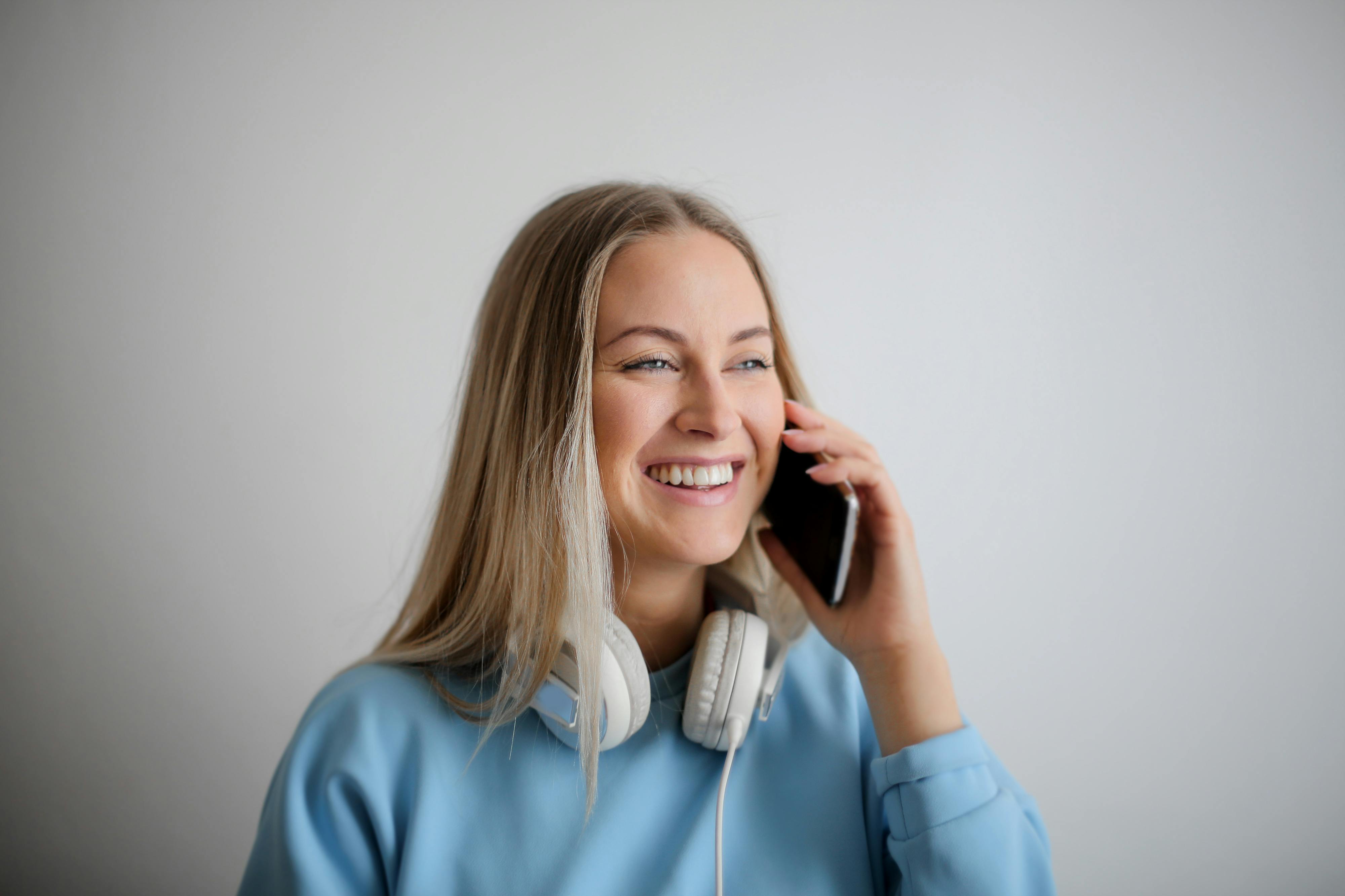 Photo by Andrea Piacquadio: https://www.pexels.com/photo/woman-in-blue-long-sleeve-shirt-holding-black-smartphone-3767421/