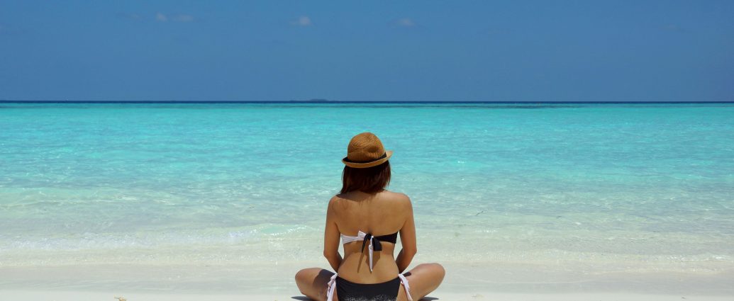 Photo by Wendy Hero: https://www.pexels.com/photo/woman-wearing-black-and-white-brassiere-sitting-on-white-sand-67818/