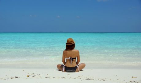 Photo by Wendy Hero: https://www.pexels.com/photo/woman-wearing-black-and-white-brassiere-sitting-on-white-sand-67818/
