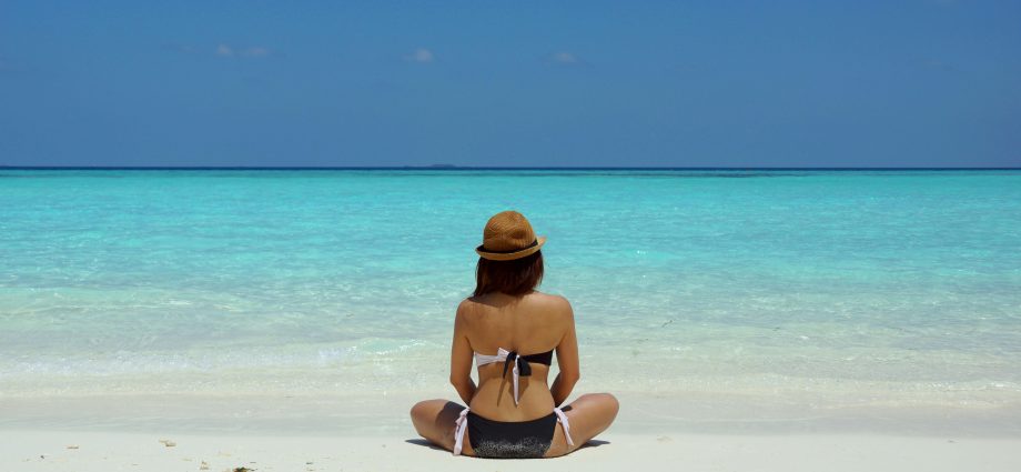 Photo by Wendy Hero: https://www.pexels.com/photo/woman-wearing-black-and-white-brassiere-sitting-on-white-sand-67818/