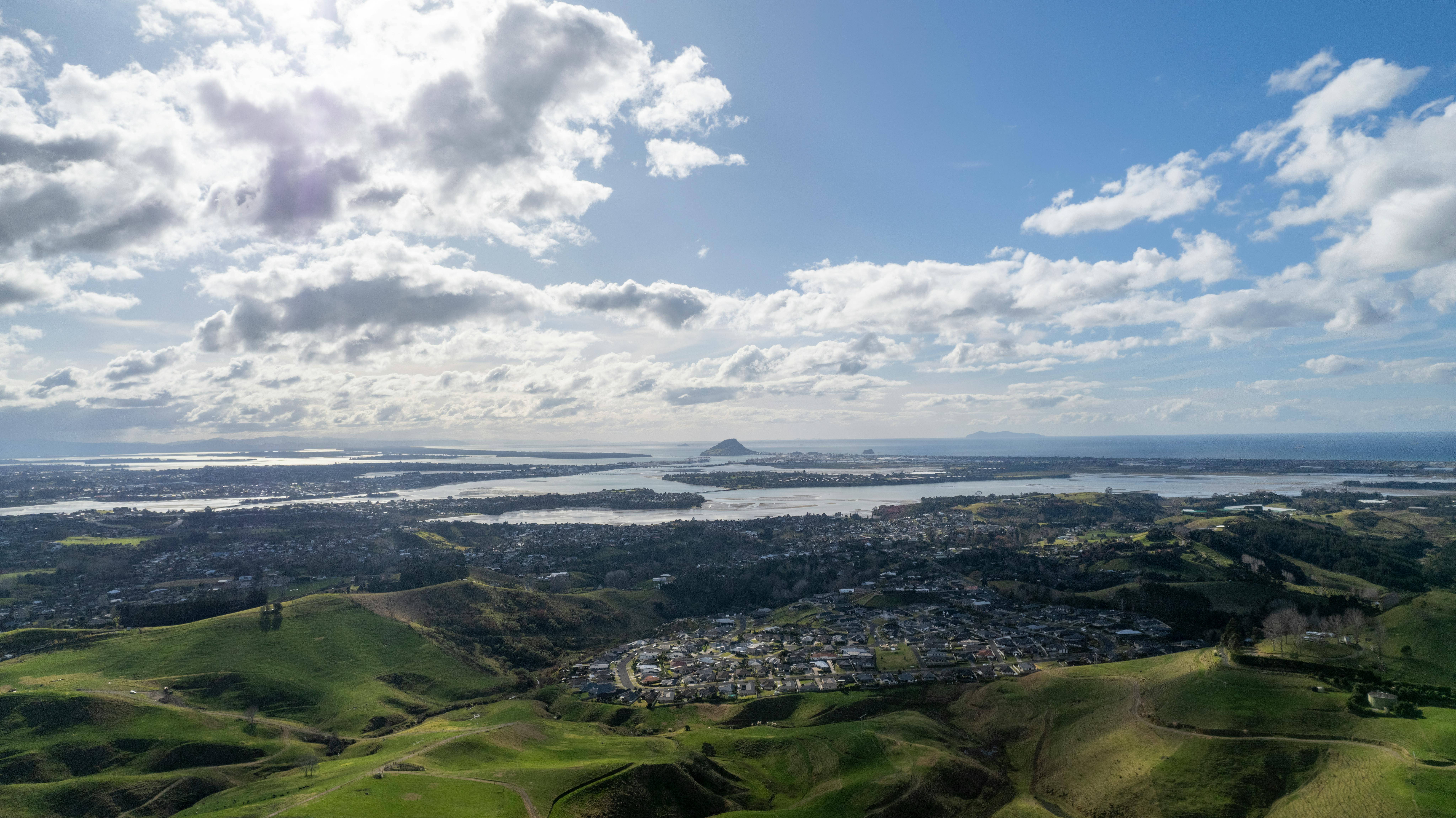 Photo by Ollie Craig: https://www.pexels.com/photo/city-on-hills-with-lakes-17982626/