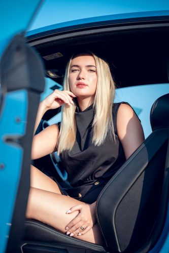 Photo by @Ali Photographer@: https://www.pexels.com/photo/portrait-of-a-woman-in-a-blue-car-21517590/